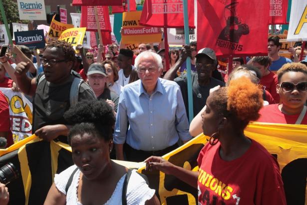 Bernie Sanders amidst a union rally