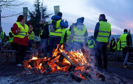Protestors around a fire.