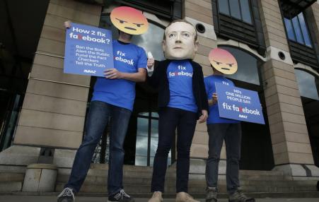 demonstrators acting against Facebook