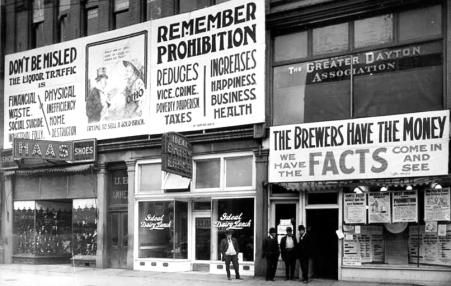 Storefronts covered with signs promoting prohibition