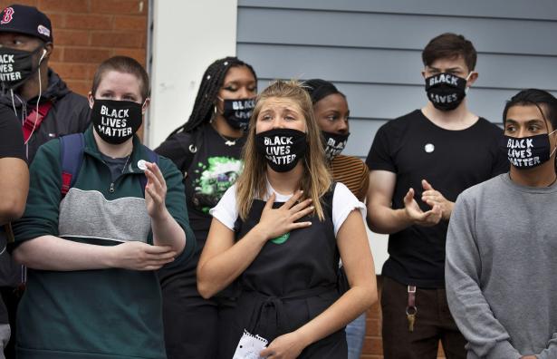 Eight protesters wearing Black Lives Matter Masks 