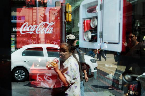 Coca-Cola products in a store window in Mexico City. ILSI shut down its Mexico branch after news media revealed that speakers at an ILSI conference on sweeteners were all advocates for the beverage industry.