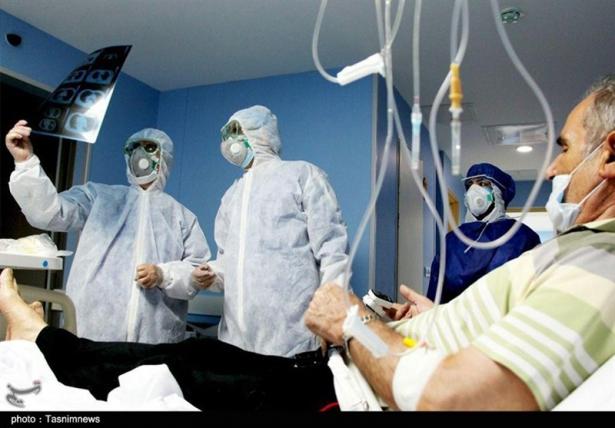 Doctors with a coronavirus patient in Iran.