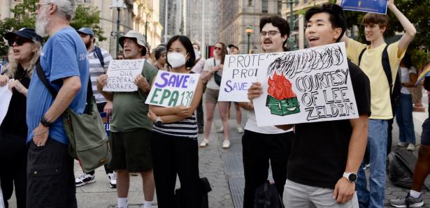 Photo of people rallying with signs like SAVE EPA.