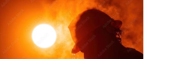 Image of a man's head with a hard hat and a hot sun.