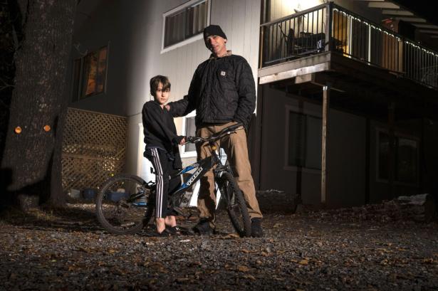 Jacques Gene and his 7-year-old son, Wyatt, at his home in Cool, near Sacramento. 