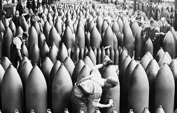 Photo of workers and supervisors in a munitions factory