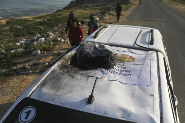 Photo of the top of a car showing a hole created from an attack.    
