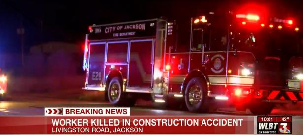 Fire engine on the street at night.