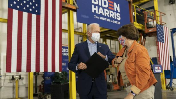 Joe Biden talking on the street with Amy Klobuchar 