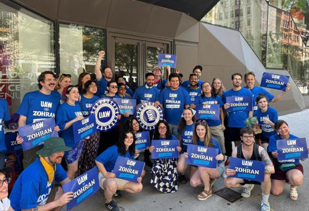 Photo of a large group of UAW members with Zohran.
