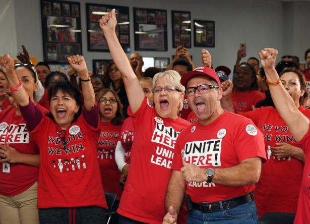 Workers in UNITE HERE teeshirts rallying 