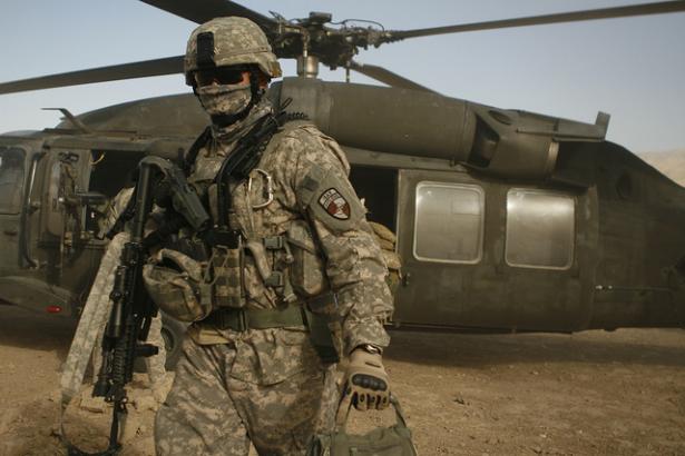 U.S. soldier exits a helicopter. 