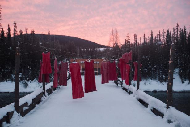 Hanging red dresses signify missing and murdered Indigenous women.