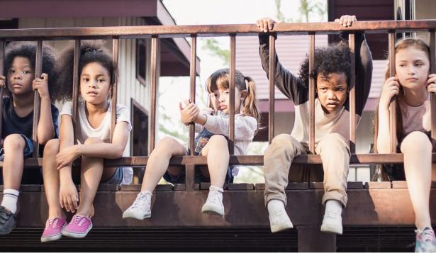 Children sitting on a balcony