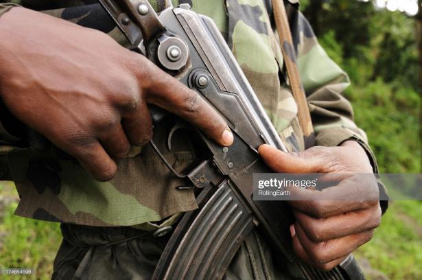 man with military style weapon