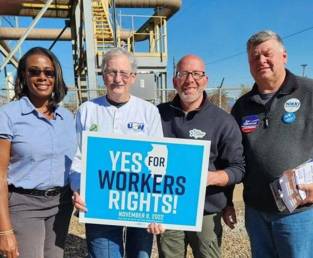 4 men holding a sign that reads YES TO WORKERS RIGHTS