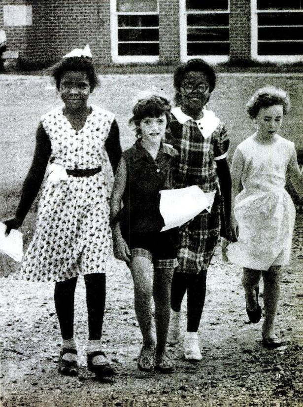 An integrated group of students, together immediately after their school was desegregated