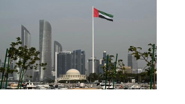 Photo of the ILO building with the ILO flag in the foreground.