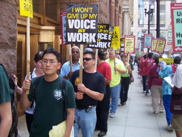 workers  on a picket line with signs