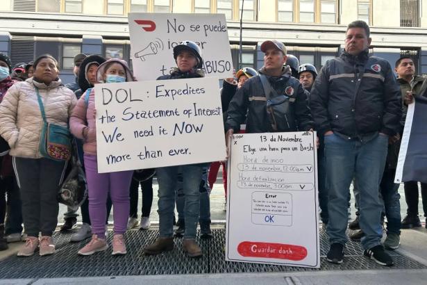 Workers holding signs such as DOL: Expedite the Statement of Interest