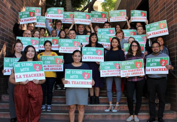 LAANE members holding Support LA teachers signs
