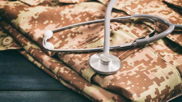 military fatigues and stethoscope
