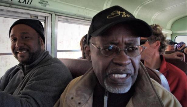 African-American men sitting in a bus