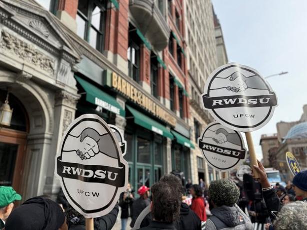 People rallying in front of a Barnes and Noble Store with RWDSU signs.m 