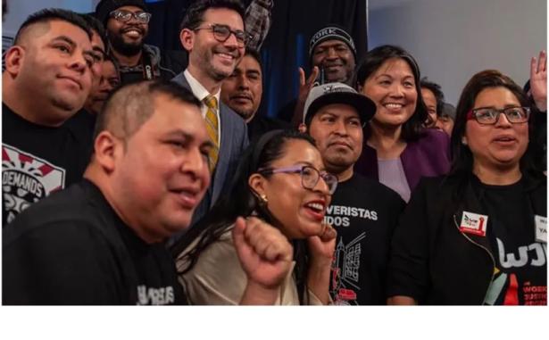 Photo of smiling people celebrating. 