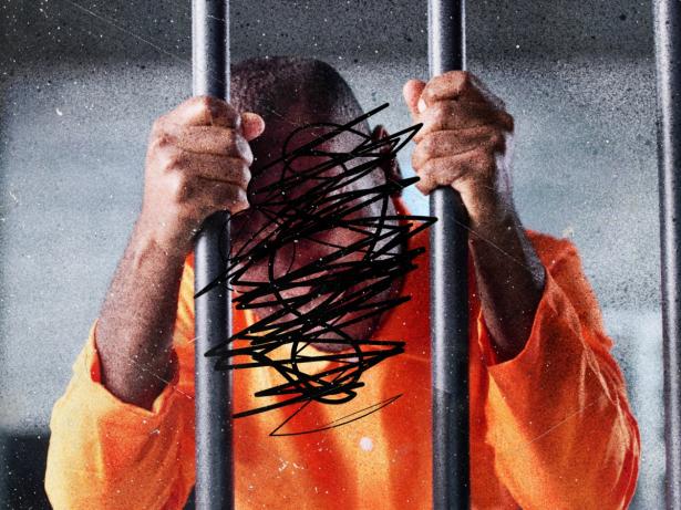 Photo of a man behind bars with his face crossed out with magic marker. 