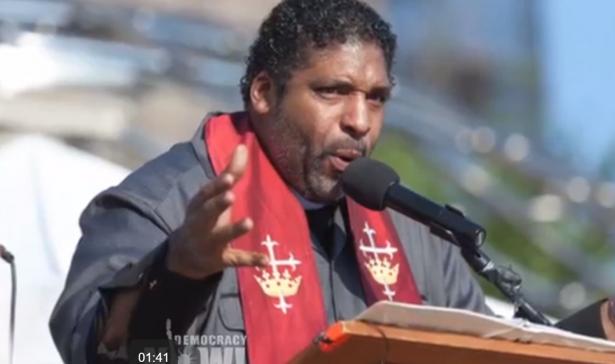 Rev William Barber speaking at a podium