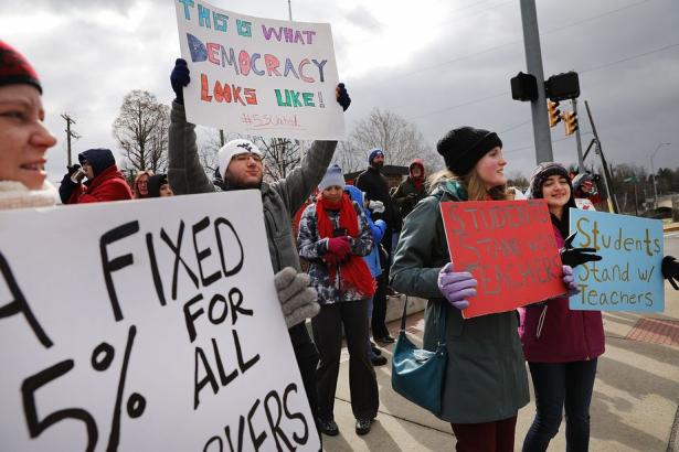 teachers with picket signs