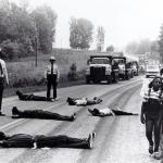 Black protestors lie on the road in 1982 to block dumping in a North Carolina landfill.