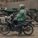 Photo of a woman on a motor bike. 