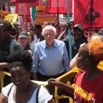 Bernie Sanders amidst a union rally