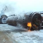 Workers cut launch tubes from a nuclear missile submarine.