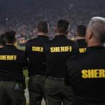 Sheriff’s deputies on the sidelines of a National Football League game.