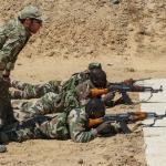 A US Army Special Forces sergeant oversees the marksmanship training of a Niger Army soldier.