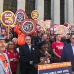 Photo of union leaders and members on the street with union signs