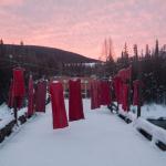 Hanging red dresses signify missing and murdered Indigenous women.