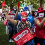 Photo of a group of nurses rallying with signs 