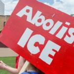 demonstration with poster calling for "Abolish ICE"