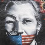 Julian Assange muzzled by USA flag