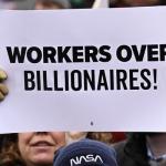 A person holds up a sign as they protest against U.S. President Donald Trump and Elon Musk's Department of Government Efficiency  A person holds up a sign as they protest against U.S. President Donald Trump and Elon Musk's Department of Government Efficiency (DOGE) in Washington, D.C. on February 5, 2025. (Photo: Drew Angerer/AFP via Getty Images)