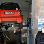Italian mechanics pictured at their garage. 