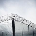 prison fence with barbed wire