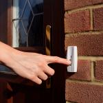 hand ringing doorbell