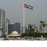 Photo of the ILO building with the ILO flag in the foreground.