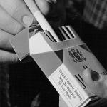 Photo of a pack of cigarettes and its health-hazard warning 
